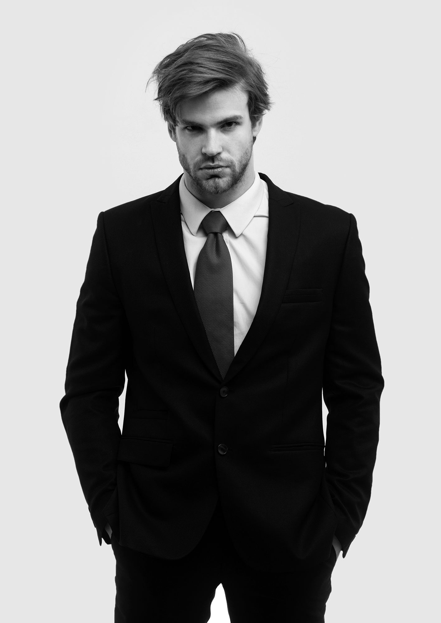 The Timeless Appeal of the Classic Black Suit: Why Every Man Needs One Paul Malone The Timeless Appeal of the Classic Black Suit: Why Every Man Needs One Paul Malone